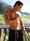 Topless muscle man Alexy Tyler drinks coffee and touches himself on the balcony in the morning