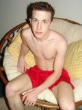 Horny student in red boxers Isaiah is showing off his nice dick and also erotic feet