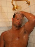 Muscled village guy Ricky M takes a relaxing shower after working hard and sunbathing