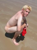 Levi bfcollection enjoys a day at the beach with his heavy balls hanging out