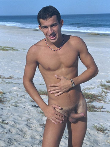 Nude Latino male Gershon is stretching in the hot sand and wanking the ram rod