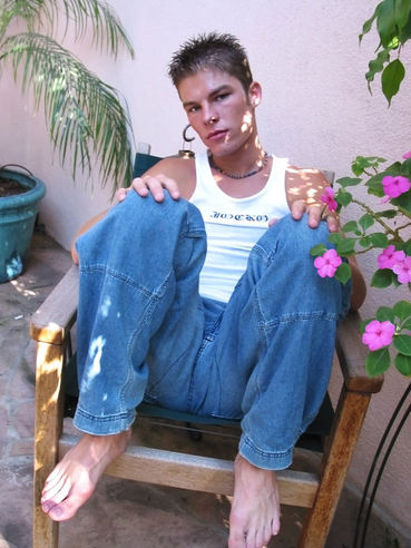 Sexy young Brady shows off his deliciously stinky feet for us while chilling outside