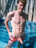 Patriotic guy Justin Slater displays his prick and hairy asshole at the poolside